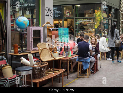 Brixton Village market, London, UK. People enjoy food and drink in Brixton Village, Brixton's iconic covered market. Stock Photo