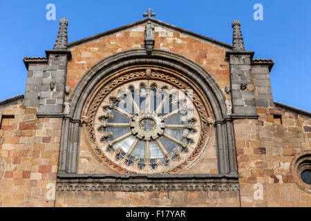 Avila, SPAIN - 10 august 2015: Santa Teresa Square, Front of the Church of San Pedro, main facade stands out its Cistercian rose Stock Photo