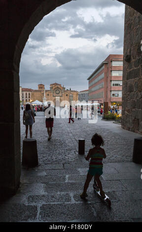 Avila, SPAIN - 10 august 2015: Santa Teresa Square, Front of the Church of San Pedro, Tourists strolling through the arc of the Stock Photo