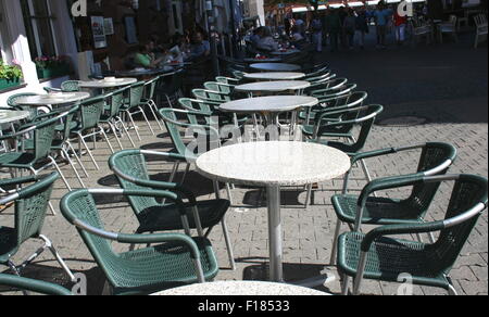 White cafe tables with green chairs, Kaiserslautern, Germany. Stock Photo