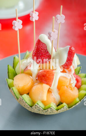 Fresh Fruit Salad in Cantaloupe Bowl on dish Stock Photo