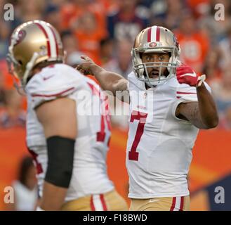 Denver, Colorado, USA. 29th Aug, 2015. San Francisco QB COLIN KAEPERNICK, left, motions for his receiver to get into position on the right side during the 1st. Half at Sports Authority Field at Mile High Saturday night. the Broncos beat the 49ers in Pre-Season play 19-12. Credit:  Hector Acevedo/ZUMA Wire/Alamy Live News