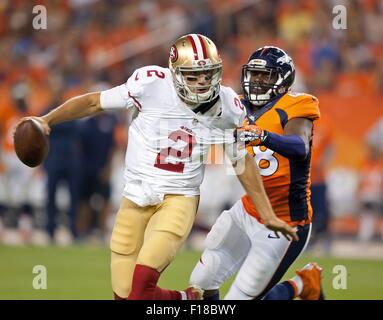 Denver, Colorado, USA. 29th Aug, 2015. 49ers QB BLAINE GABBERT, left, runs away from a tackle during the 2nd. Half at Sports Authority Field at Mile High Saturday night. the Broncos beat the 49ers in Pre-Season play 19-12. Credit:  Hector Acevedo/ZUMA Wire/Alamy Live News Stock Photo