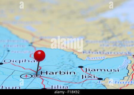 Harbin pinned on a map of Asia Stock Photo