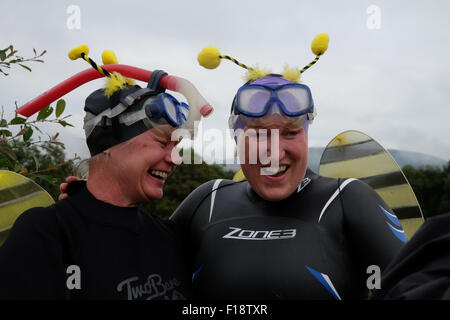 Llanwrtyd Wells, Powys, Wales, UK. 30th August, 2015.  Competitors in fancy dress at the 30th World Bog Snorkelling Championship being held in two water filled boggy trenches in Mid Wales. Stock Photo