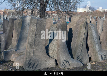 Fallen gravestones of the ancient Jewish cemetery in Berdychiv, Ukraine Stock Photo