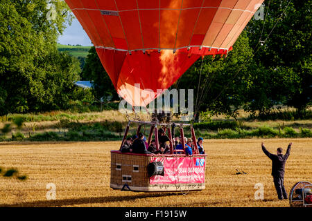 Hot air balloon taking off in South Lanarksdhire in Scotland Stock Photo