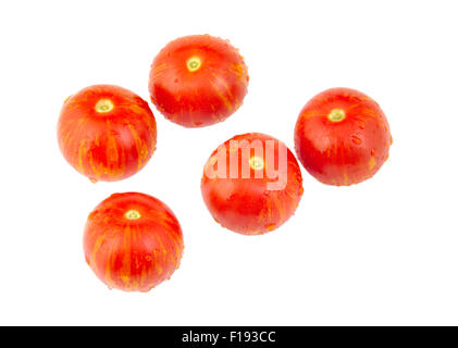 Five cherry tomatoes isolated on white background Stock Photo