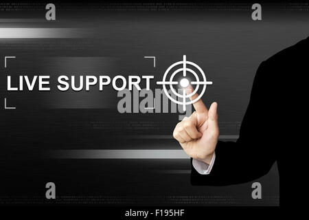 business hand clicking live support button on a touch screen interface Stock Photo