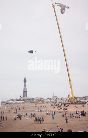 Blackpool, UK. 30th August, 2015. A cloudy morning in Blackpool but the conditions are almost perfect for the 'Base jumpers' taking their leap of faith off a 320 foot high crane on Blackpool's beach. Credit: Gary Telford/Alamy live news Stock Photo