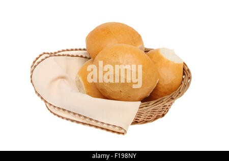 Crusty bread rolls in a basket with a serviette isolated against white Stock Photo