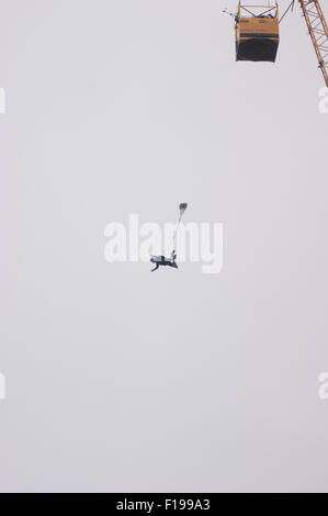 Blackpool, UK. 30th August, 2015. A cloudy morning in Blackpool but the conditions are almost perfect for the 'Base jumpers' taking their leap of faith off a 320 foot high crane on Blackpool's beach. Credit: Gary Telford/Alamy live news Stock Photo