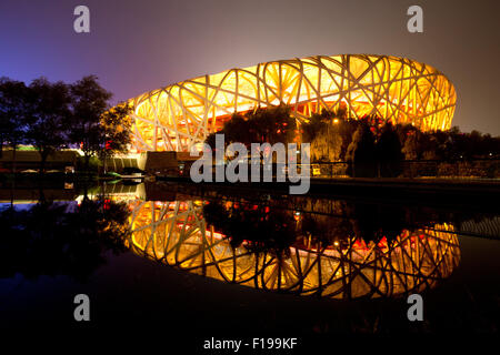 Beijing, China. 28th Aug, 2015. The National stadium, known as Bird's Nest, is illuminated during the closing ceremony at the 15th International Association of Athletics Federations (IAAF) Athletics World Championships in Beijing, China, 28 August 2015. Photo: Christian Charisius/dpa/Alamy Live News Stock Photo