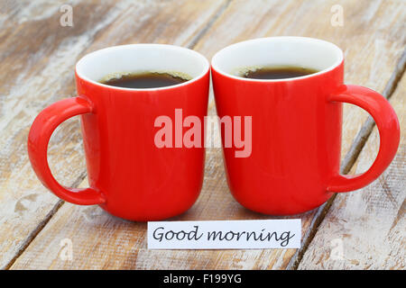 Good morning card with two red mugs of coffee Stock Photo