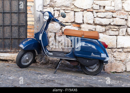 Gaeta, Italy - August 19, 2015: Classic blue Vespa PX 150 scooter stands parked in a town Stock Photo
