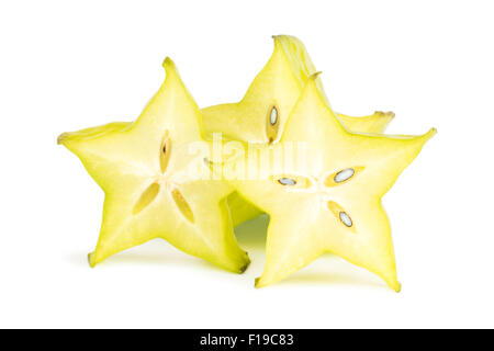 Close-up of three carambola (starfruit) slices, viewed from the front, isolated on white background. Stock Photo