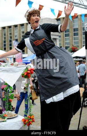 Bolton, UK. 30th Aug, 2015. The 10th annual Bolton Food and Drink Festival, Victoria Square, Bolton, Lancashire. Street entertainer Bridie the Tea Lady poses for her picture. Credit:  Paul Heyes/Alamy Live News Stock Photo