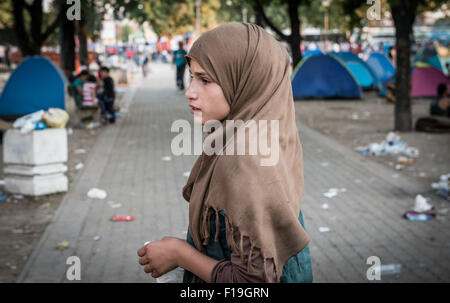 Belgrade, Serbia. 29th August 2015. Young girl in makeshift camp in Belgrade’s Bristol Park. Serbia is one of the main stopping points for Syrian, Iraqi and Afghan refugees trying to reach northern Europe. Stock Photo