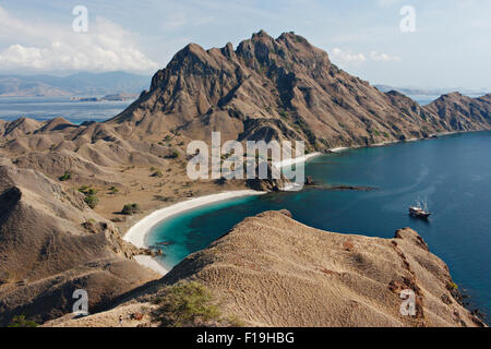 px2296-D. amazing view from atop Padar Island, Komodo National Park. Dive boat 'Seven Seas' in bay. Indonesia, Pacific Ocean. Ph Stock Photo