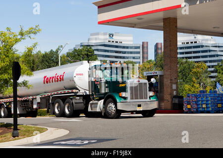 A fuel tank tractor trailer parked at a Shell gas station - California ...