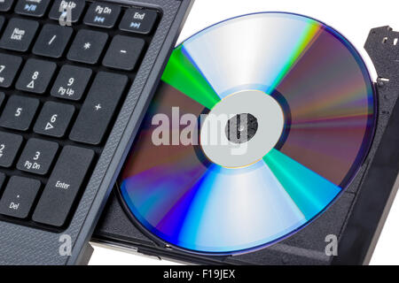 Electronic collection - Laptop with open DVD tray isolated on a white background Stock Photo