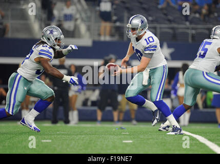 Dallas Cowboys quarterback Dustin Vaughan (10) hands the ball to ...