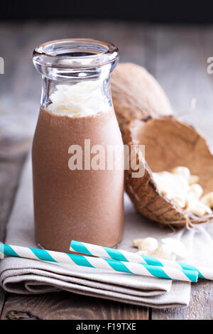 Healthy vegan chocolate coconut cashew shake in a bottle Stock Photo