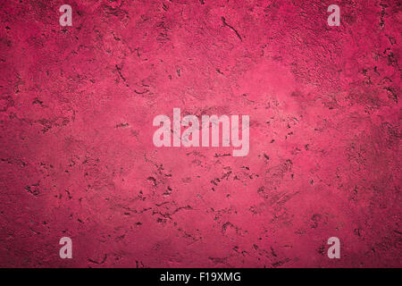 Front view of a wall decorated with pink plaster. Stock Photo
