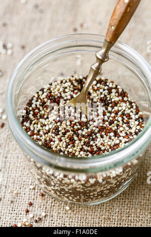 Various types of quinoa in a glass bowl Stock Photo