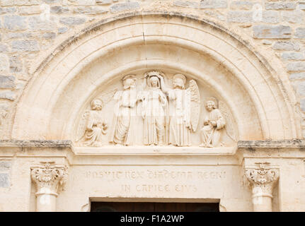 Stone carving above church door Montaud, Hérault,  Languedoc-Roussillon, France, Europe Stock Photo