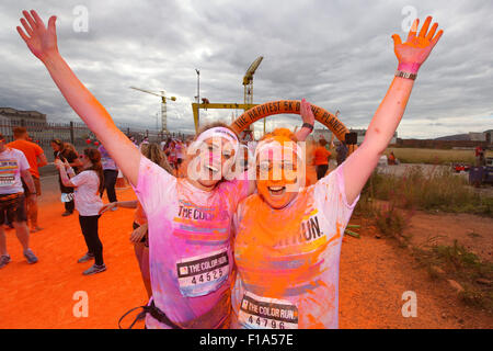 Belfast, Northern Ireland, UK. 30th Aug, 2015. Thousands of runners of all ages, shapes and sizes took part in the 2015 The Color Run at Belfast's Titanic Quarter on Sunday 30th August 2015. the Color Run is described as the happiest 5k on the planet! The Color Run is an un-timed celebration of health and colour, meaning groups of friends can walk, jog, dance and party their way along the course at any pace. At each kilometre, colour explosions cover runners in kaleidoscope fashion before DJs entertain the crowd at the Colour Festival Area after the finish line. Credit:  Bonzo/Alamy Live News Stock Photo