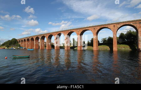 Brick viaduct reflected in Montrose Basin Scotland  August 2015 Stock Photo