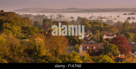 Sunrise Over Dorset Countryside with early morning mist in the gently rolling hills Stock Photo