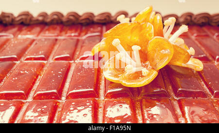 Details of an orange flower, made of sugar as decoration on birthday cake. Stock Photo