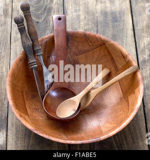 Wood kitchen utensils over wooden table background, close up Stock Photo