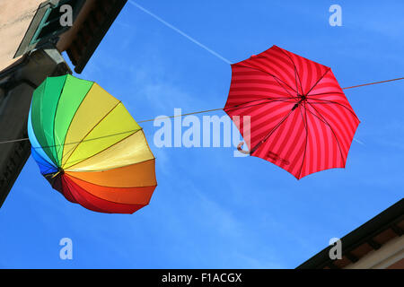 Bomarzo, Italy, umbrellas hanging in sunshine on a clothes line Stock Photo