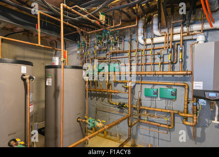 Copper Water Pipes In Basement Of New Large Home Stock Photo