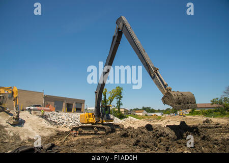 Large Backhoe At Construction Site Stock Photo
