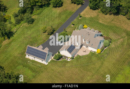 Aerial View Of House With Solar Panels Stock Photo