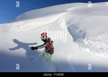 Krippenbrunn, Austria, a boy snowboarding in deep snow Stock Photo