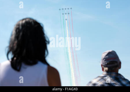 SLIAC, SLOVAKIA - AUGUST 29: Spectators watch amazing show of Italian aerobatic team Frecce Tricolori at SIAF airshow in Sliac, Slovakia on August 29, 2015 Credit:  Lubos Paukeje/Alamy Live News Stock Photo
