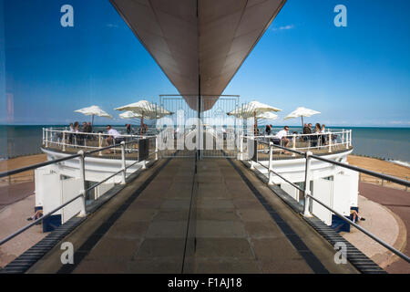 Reflections of the Azur restaurant and seafront at the Marina Pavilion, a 1930's building on the promenade St Leonards on Sea, E Stock Photo