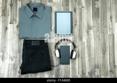 Informal male outfit with electronics, background Stock Photo