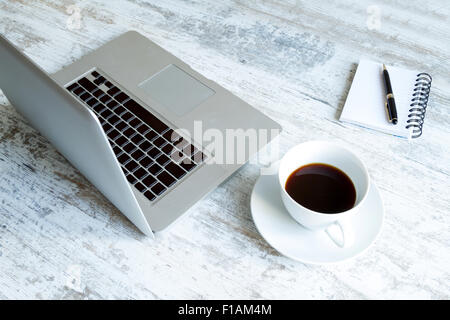 Working in the computer and drinking a coffee Stock Photo