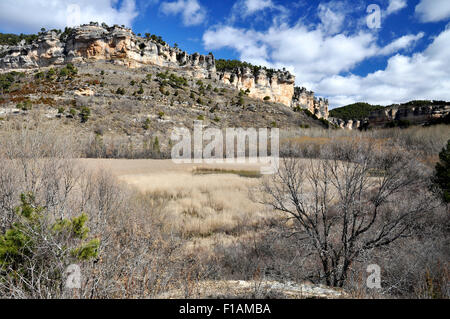 Scenery view of Laguna de Uña lagoon with reeds and surrounding cliffs in Serrania de Cuenca Natural Park (Cuenca, Castilla-La Mancha, Spain) Stock Photo