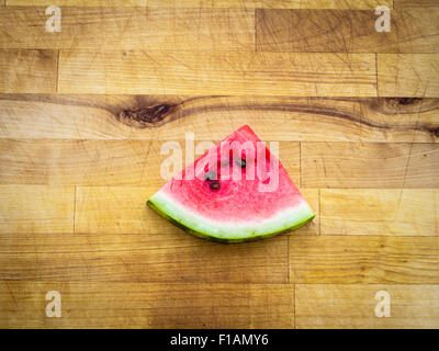Watermelon slice arranged on a wooden board Stock Photo