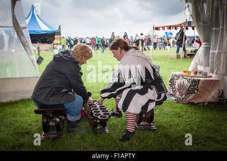 Cheshire, UK. 31st Aug, 2015. Two ladies play a historic game of Mancala at the Cheshire Game & Country Fair held at the Cheshire Game and Country Show at the Cheshire County Showground Credit:  John Hopkins/Alamy Live News Stock Photo