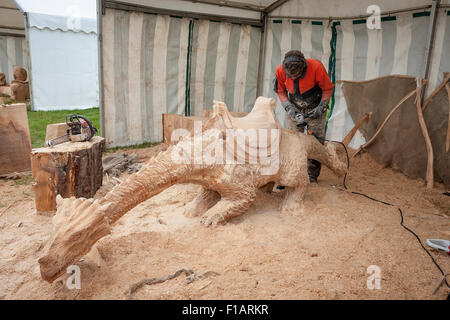 Cheshire, UK. 31st Aug, 2015. Simon O'Rourke completes his carving of a Dragon at The 11th English Open Chainsaw Carving Competition held at the Cheshire Game and Country Show at the Cheshire County Showground Credit:  John Hopkins/Alamy Live News Stock Photo