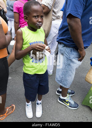 Boy with ice cream on face at Spike Lee block party in the Bedford Stuyvesant section of Brooklyn, New York, Aug. 29, 20015. Stock Photo