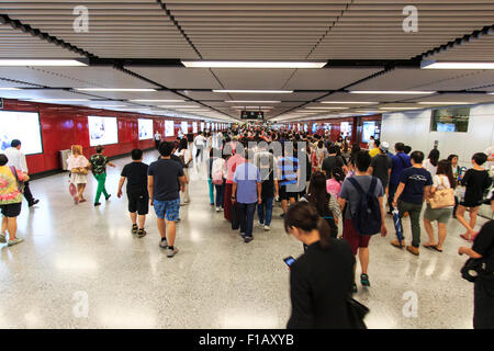 Kowloon, Hong Kong - August 14,2015: Commuters waiting for a train in the MTR Wan Chai in Hong Kong Stock Photo